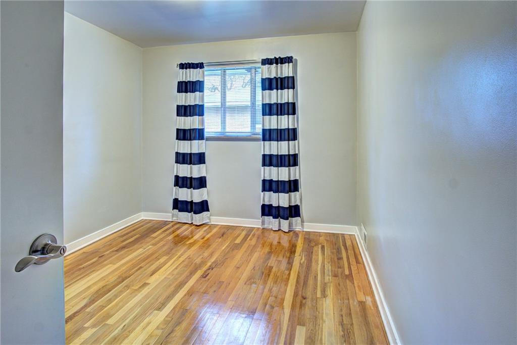 118 Siebert Road Pittsburgh, PA 15237 - Photo 19 of 25 a view of a bedroom with a bed and a window