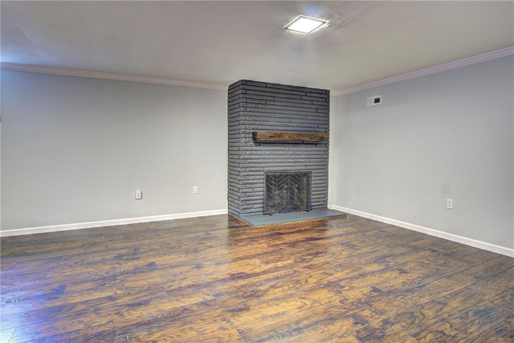 118 Siebert Road Pittsburgh, PA 15237 - Photo 20 of 25 a view of an empty room with wooden floor and a fireplace