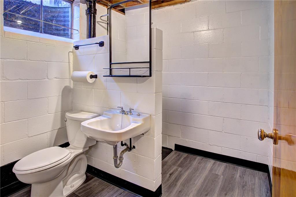 118 Siebert Road Pittsburgh, PA 15237 - Photo 21 of 25 a bathroom with a sink toilet and a mirror