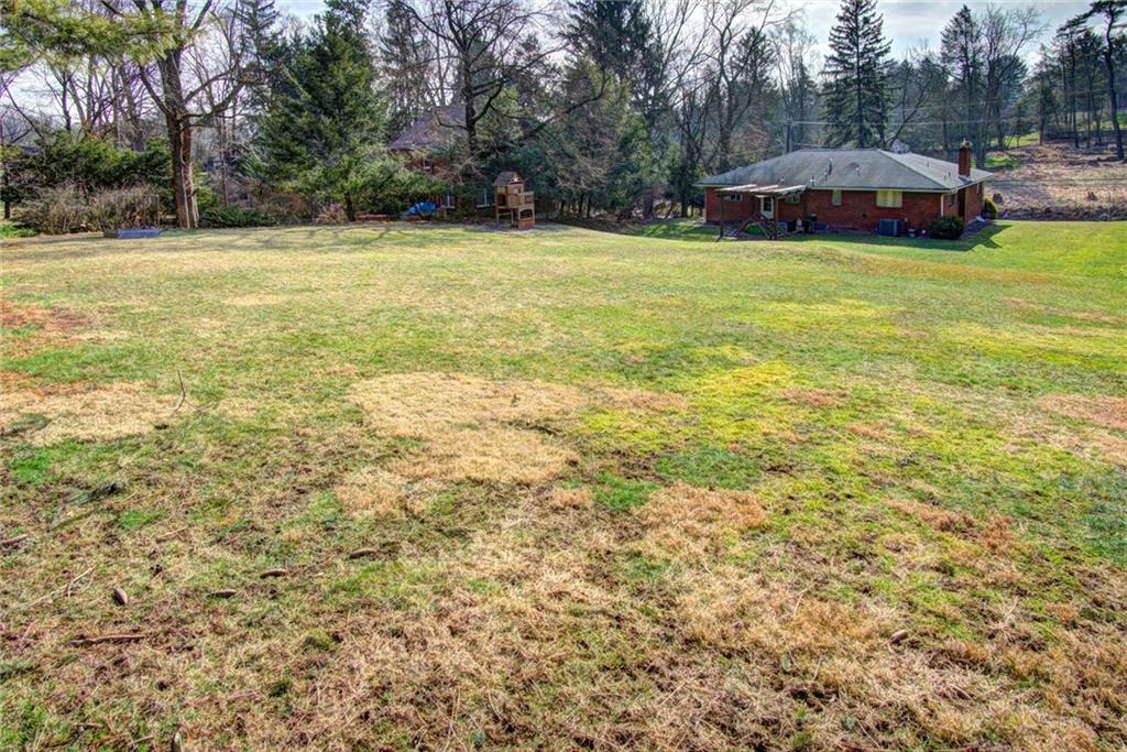 118 Siebert Road Pittsburgh, PA 15237 - Photo 25 of 25 a view of a swimming pool and trees in the background