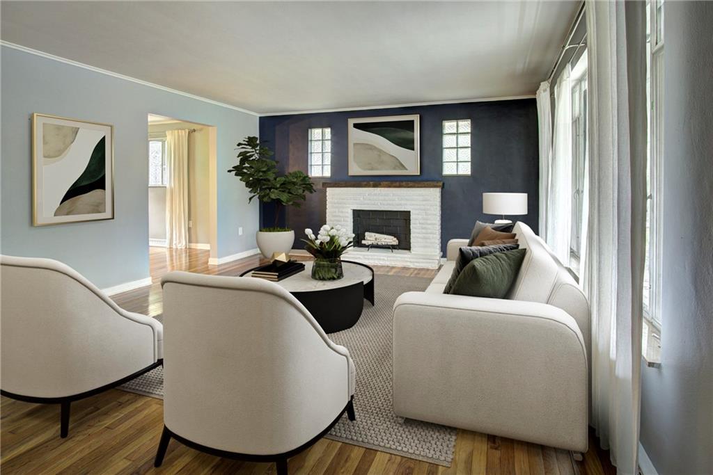 118 Siebert Road Pittsburgh, PA 15237 - Photo 5 of 25 a living room with furniture a fireplace and a potted plant