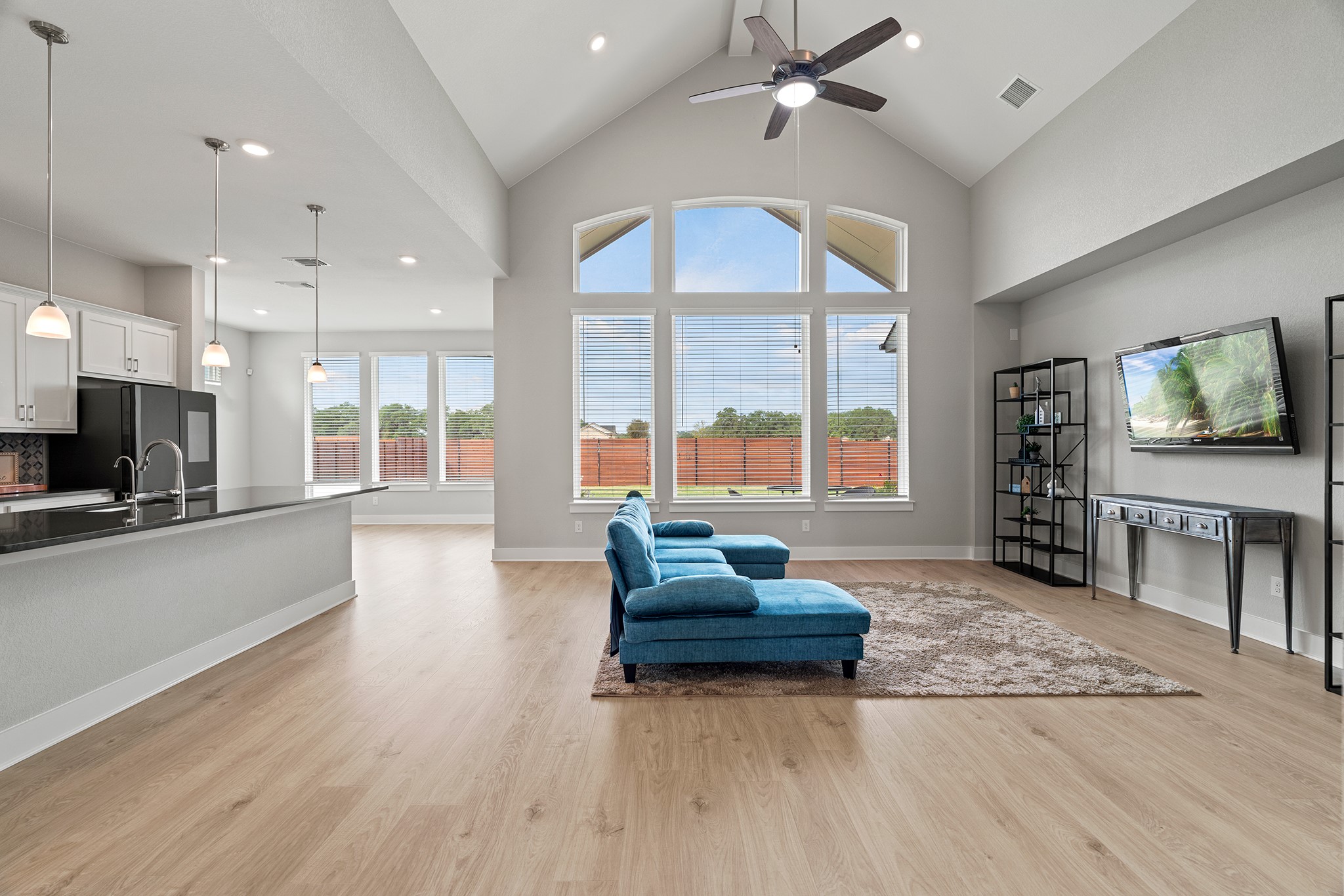 2112 Tobiano Trace Georgetown, TX 78633 - Photo 4 of 40 Living area featuring high vaulted ceiling, light wood-style floors, recessed lighting, and ceiling fan