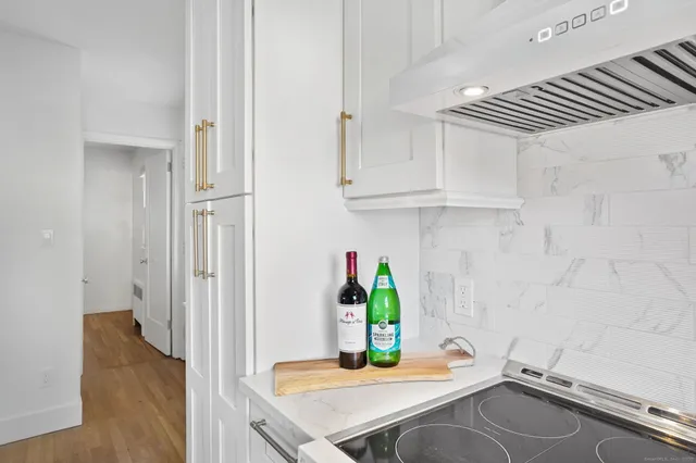 a room with a sink and cabinets