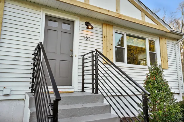 a view of a balcony with wooden floor and stairs