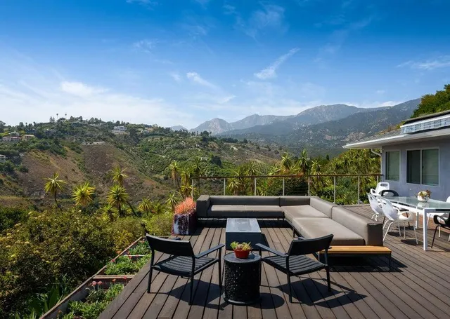 a view of house with outdoor seating space