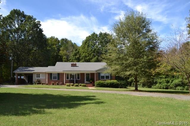 864 State Rd S-29-39 Lancaster, SC 29720 - Photo 1 of 22 a front view of a house with a yard table and chairs