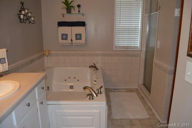 864 State Rd S-29-39 Lancaster, SC 29720 - Photo 14 of 22 a bathroom with a sink a vanity and a bathtub