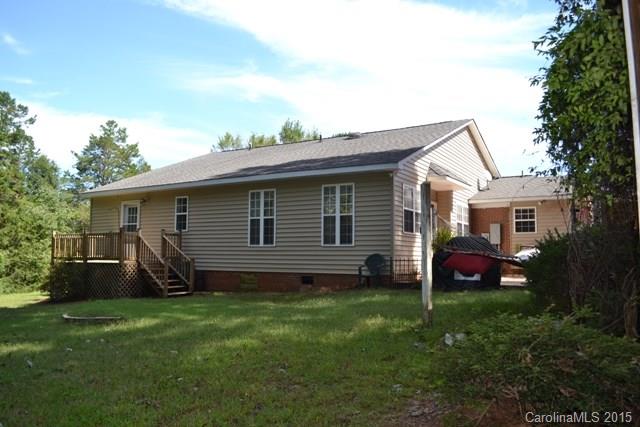 864 State Rd S-29-39 Lancaster, SC 29720 - Photo 21 of 22 a front view of house with a garden and patio