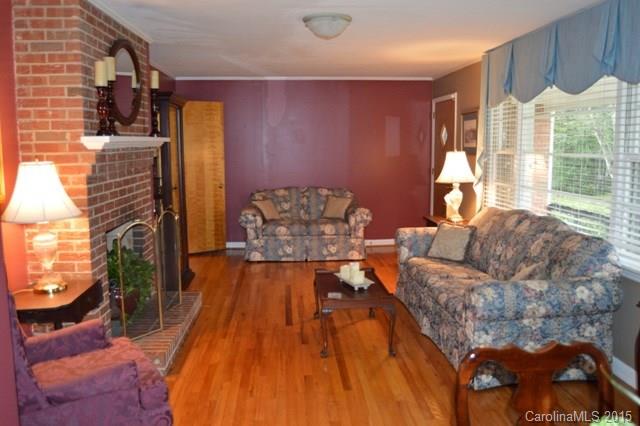 864 State Rd S-29-39 Lancaster, SC 29720 - Photo 4 of 22 a living room with furniture and a fireplace