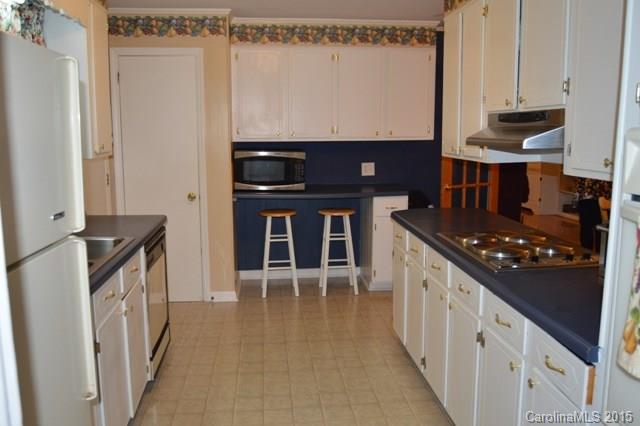 864 State Rd S-29-39 Lancaster, SC 29720 - Photo 8 of 22 a kitchen with stainless steel appliances a stove and a refrigerator
