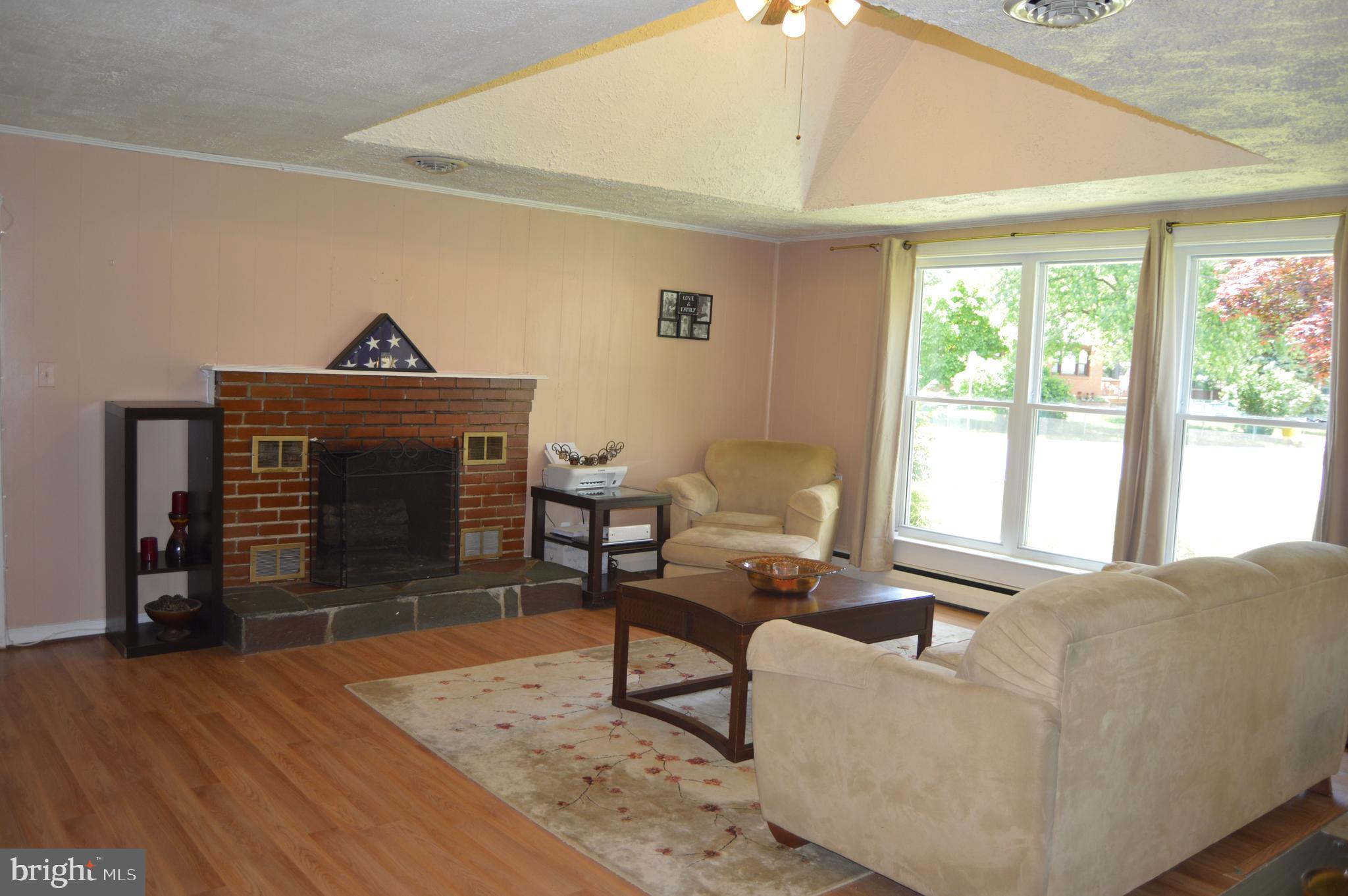 19 Melville Road Pasadena, MD 21122 - Photo 2 of 32 Large open Living Rm. w/brk F/P, high ceiling.