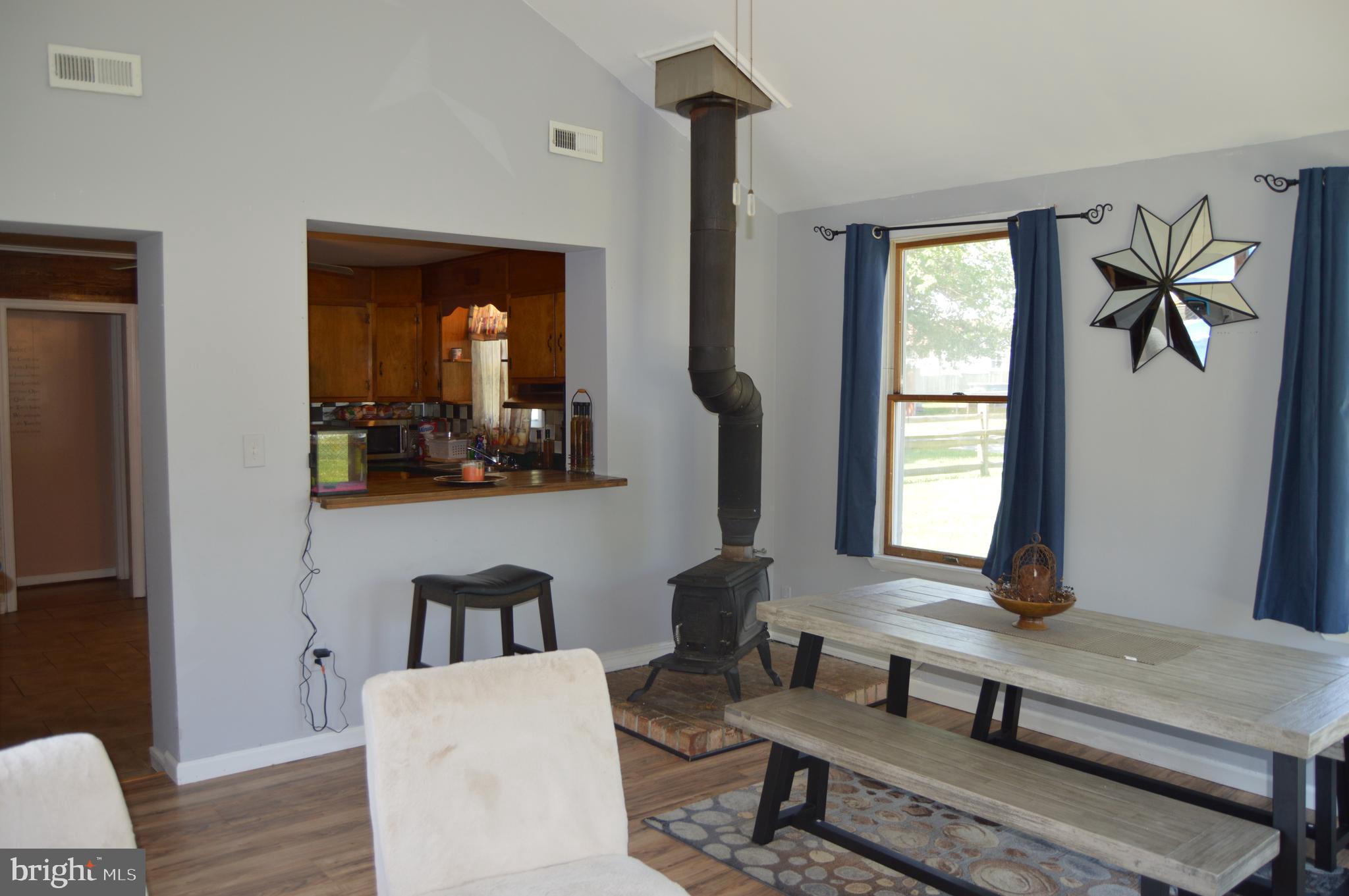 19 Melville Road Pasadena, MD 21122 - Photo 9 of 32 Cath. ceiling, lots of light, w/s, slider to deck