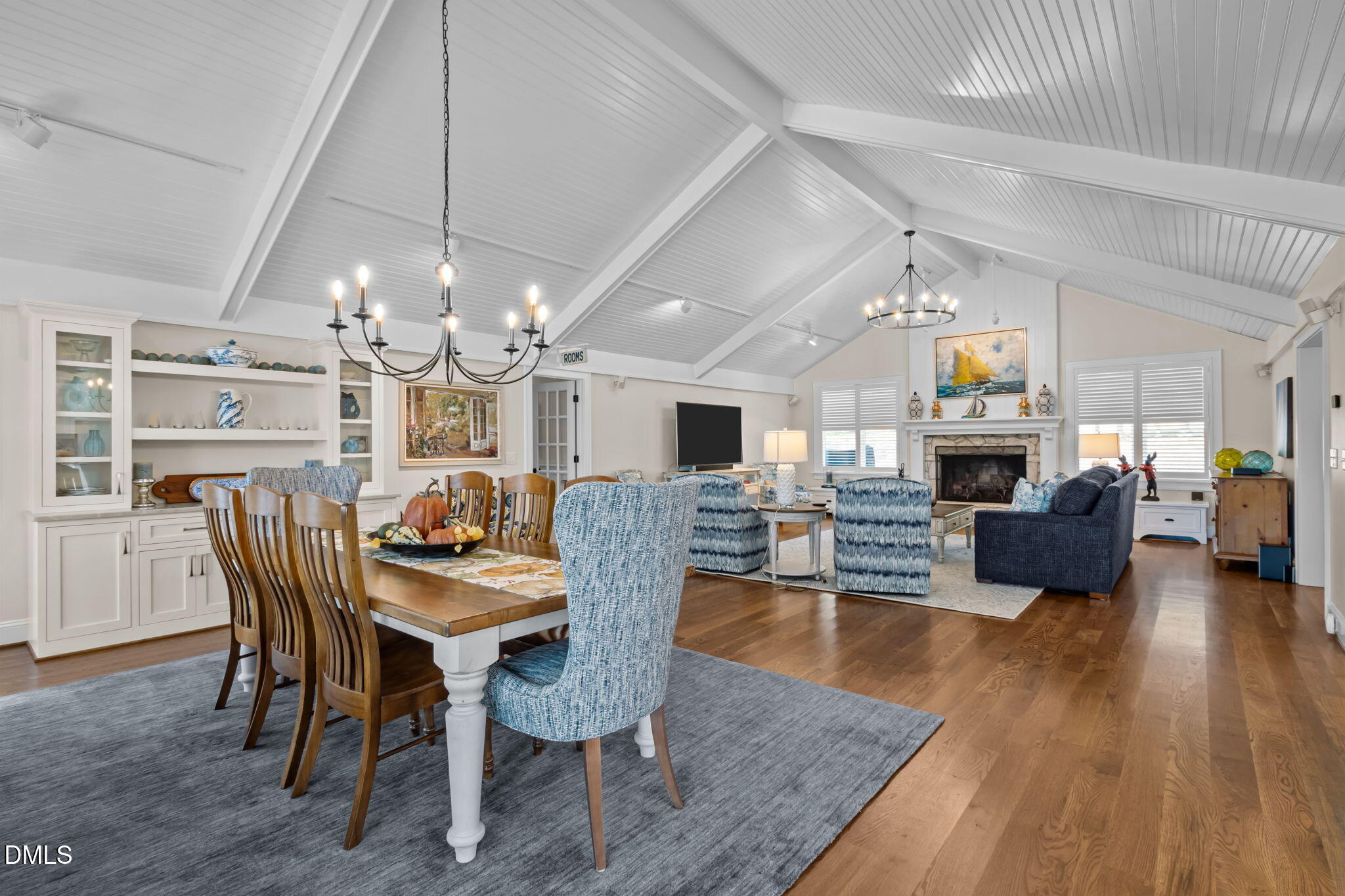 515 Oak Pointe Drive Semora, NC 27343 - Photo 19 of 66 a view of a dining room with furniture a chandelier and wooden floor