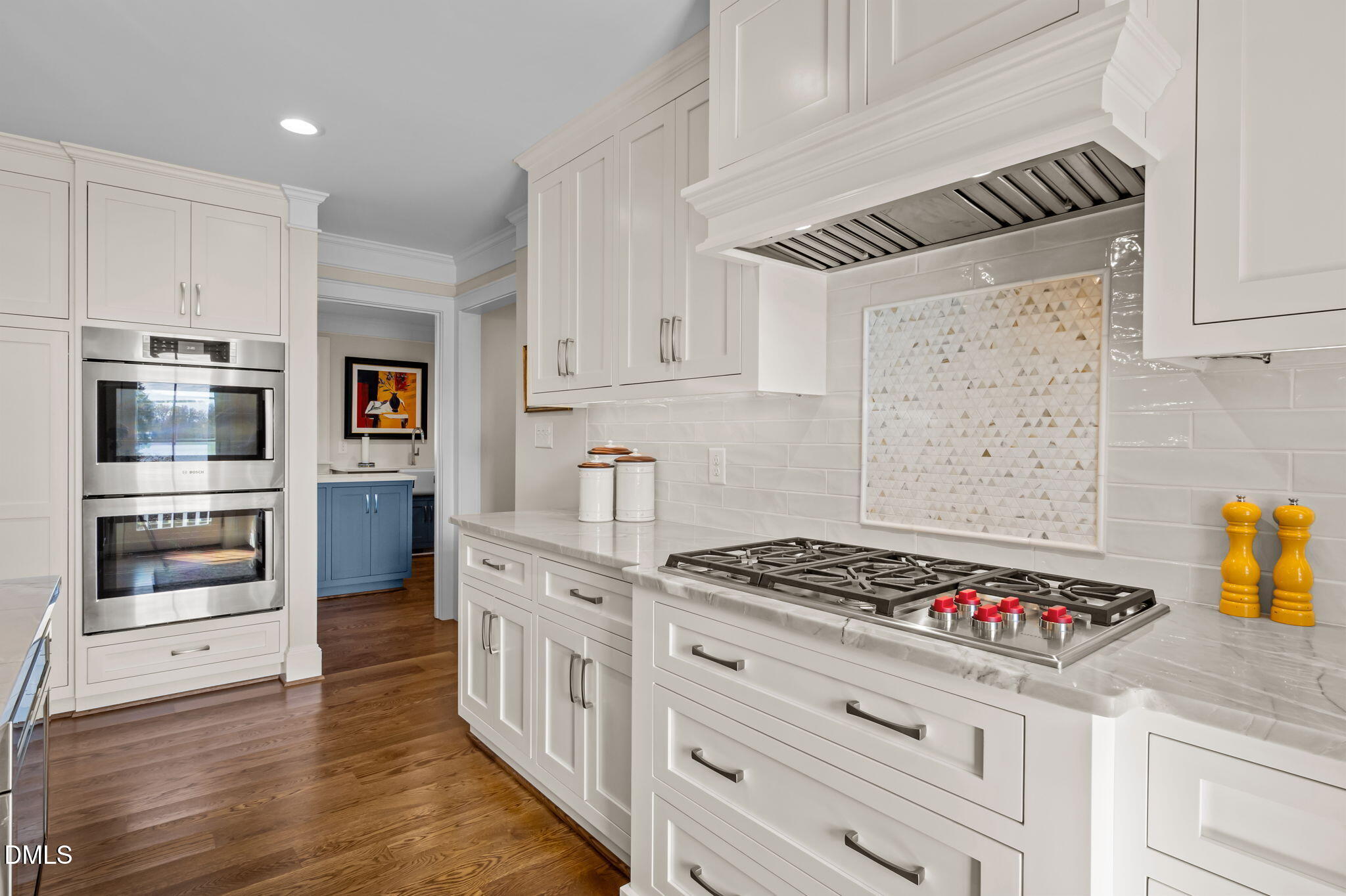 515 Oak Pointe Drive Semora, NC 27343 - Photo 25 of 66 a kitchen with granite countertop a stove and cabinets