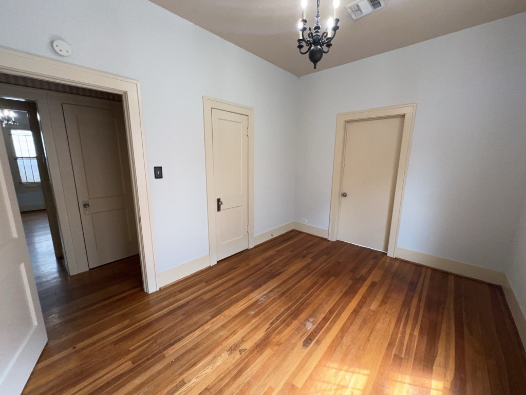 4716 Crawford Street Houston, TX 77004 - Photo 10 of 15 a view of a room with wooden floor and staircase