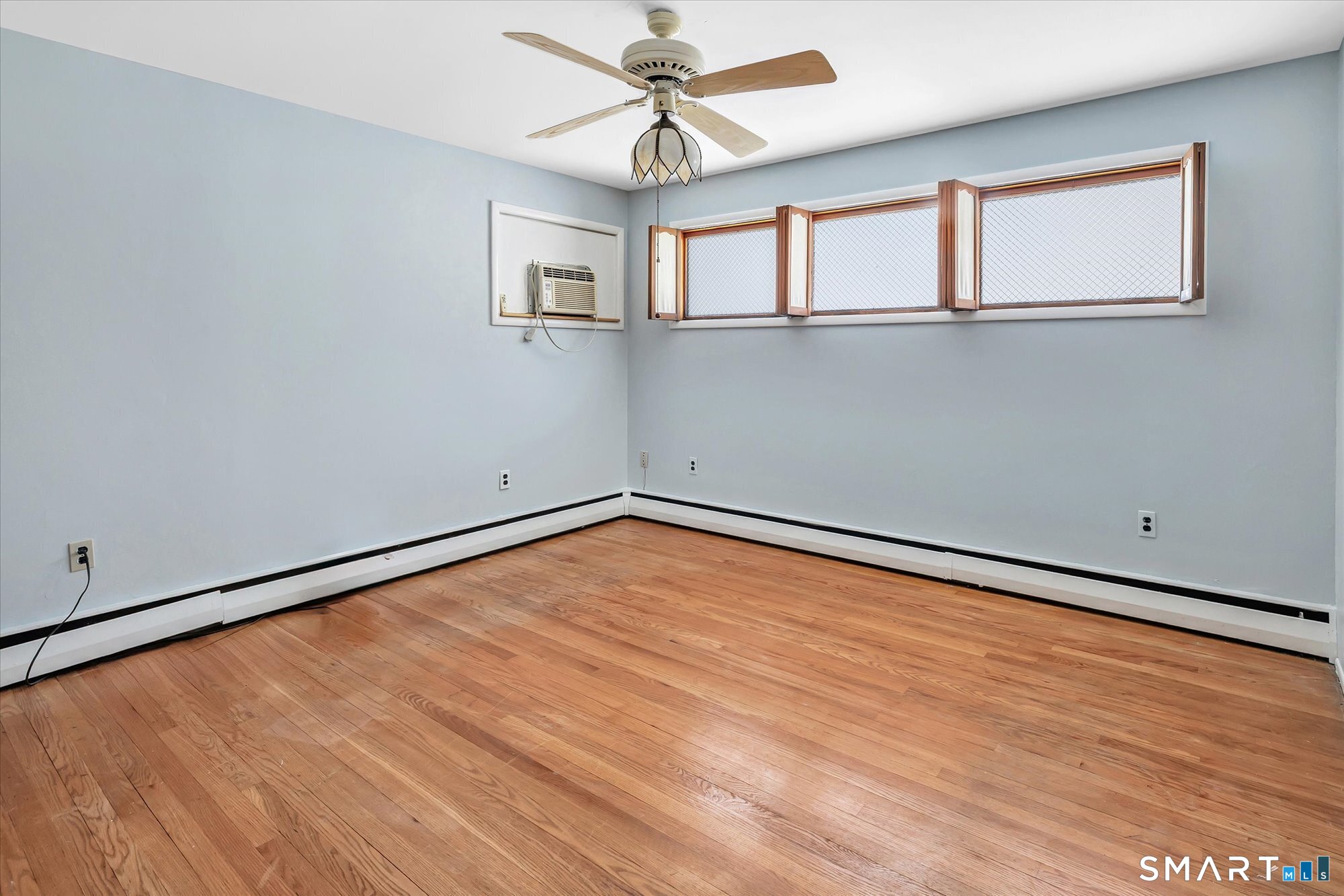 61 Soundview Avenue Shelton, CT 06484 - Photo 16 of 33 wooden floor in an empty room with a window