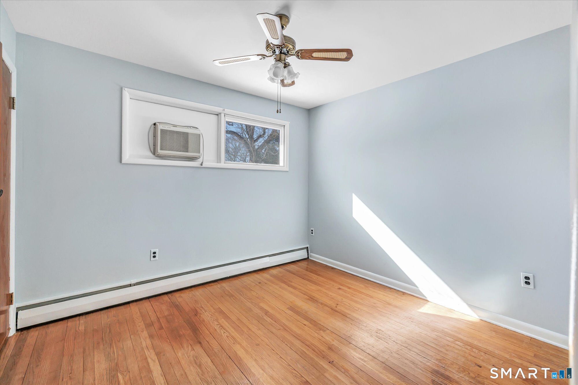 61 Soundview Avenue Shelton, CT 06484 - Photo 18 of 33 wooden floor in an empty room with a window
