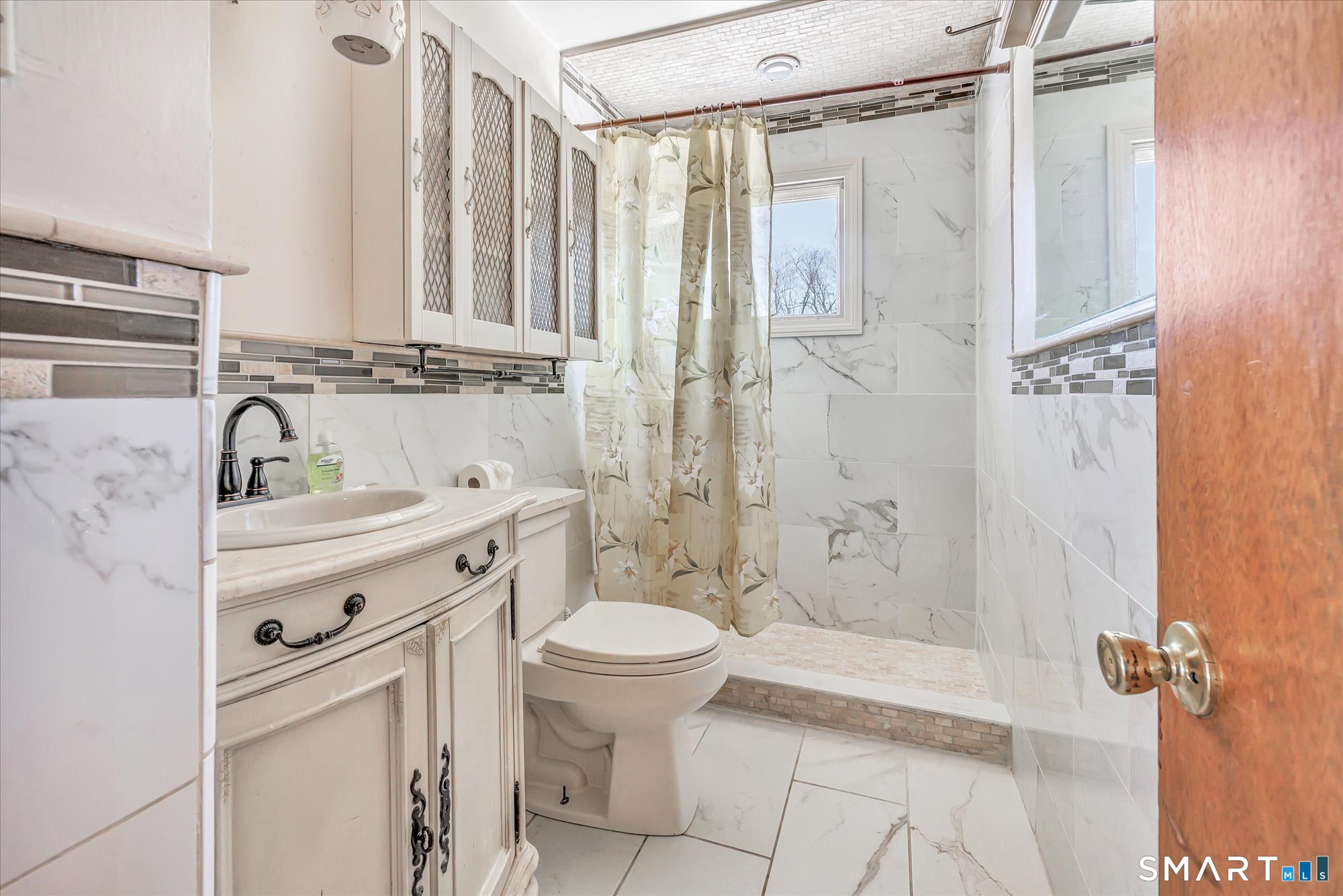 61 Soundview Avenue Shelton, CT 06484 - Photo 22 of 33 a bathroom with a sink toilet and shower