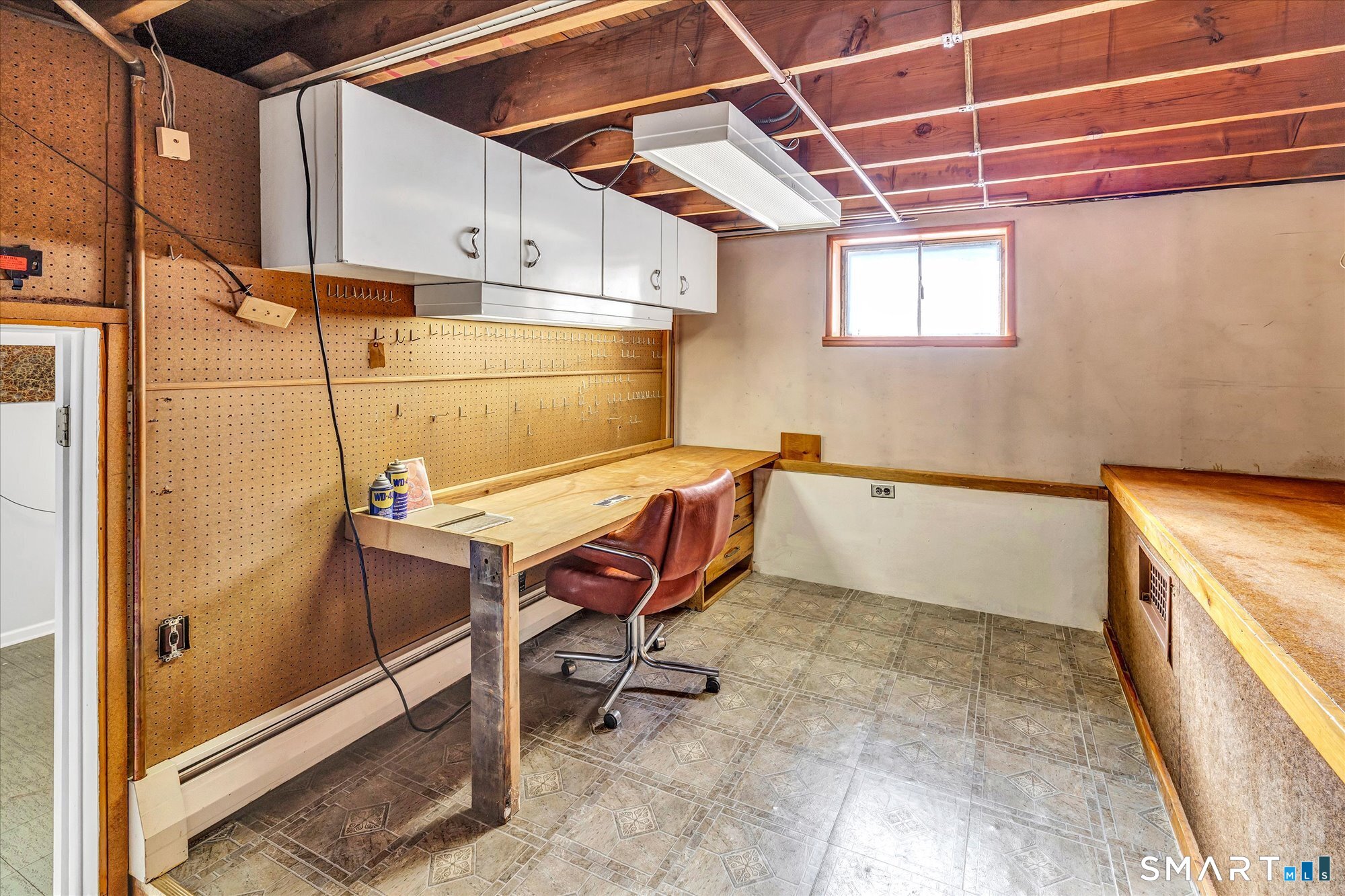 61 Soundview Avenue Shelton, CT 06484 - Photo 23 of 33 a room with table chair and appliances