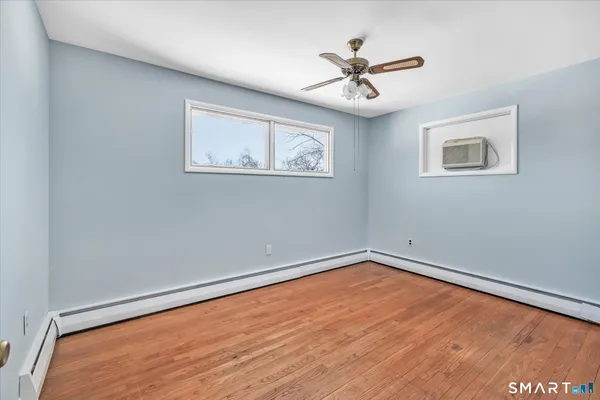 a view of room with window and ceiling fan