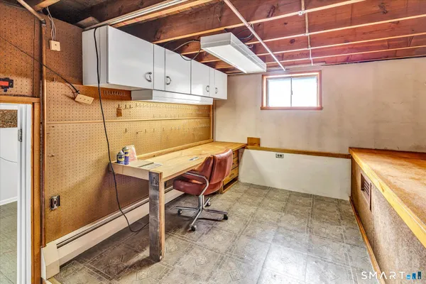 a room with table chair and appliances