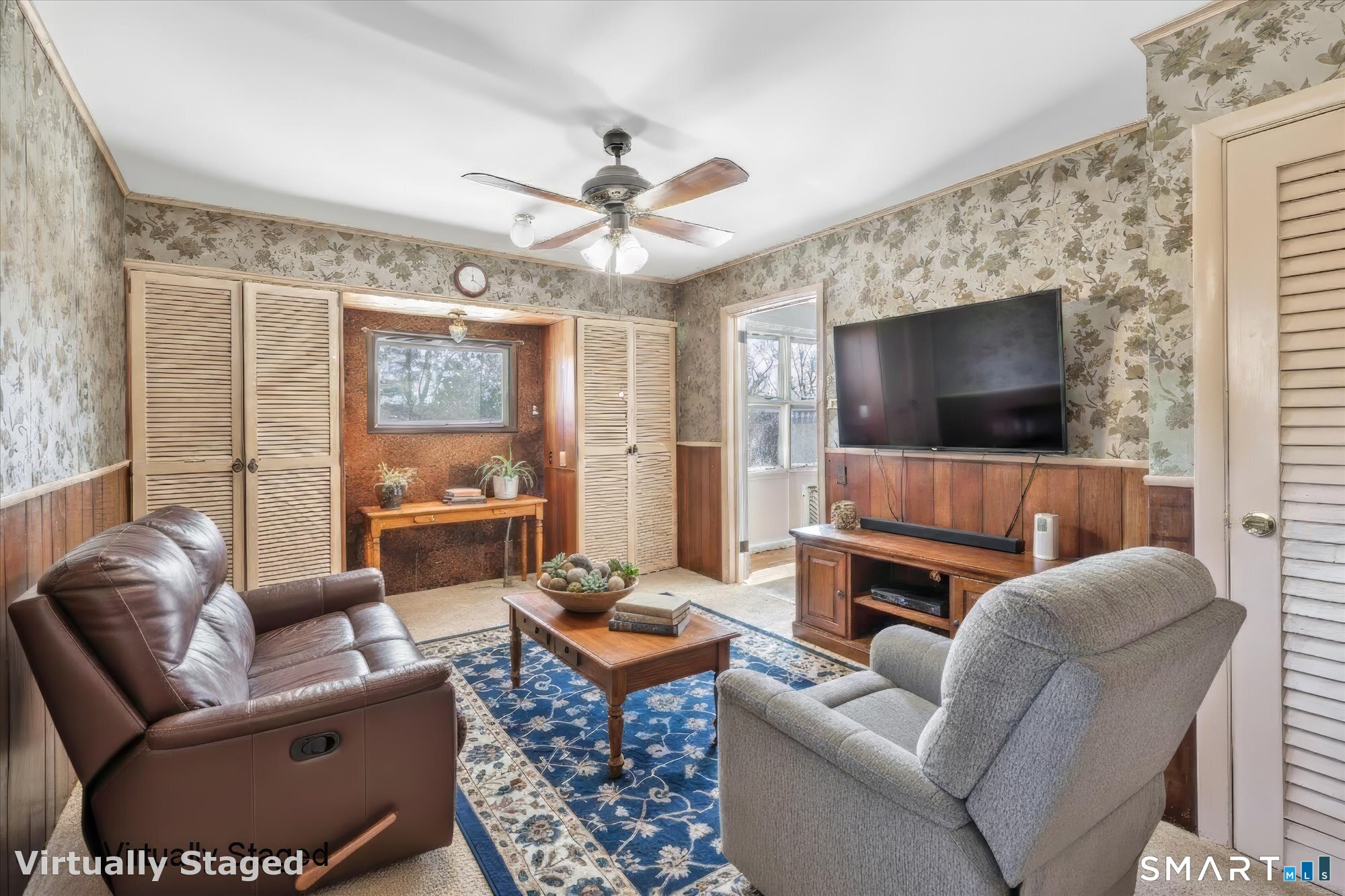 61 Soundview Avenue Shelton, CT 06484 - Photo 9 of 33 a living room with furniture a flat screen tv and a large window
