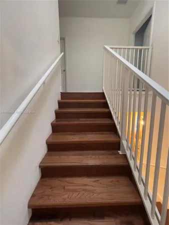 a view of a hallway with front door