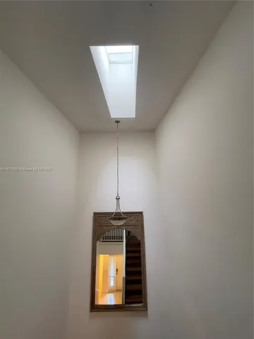 a view of a hallway with front door