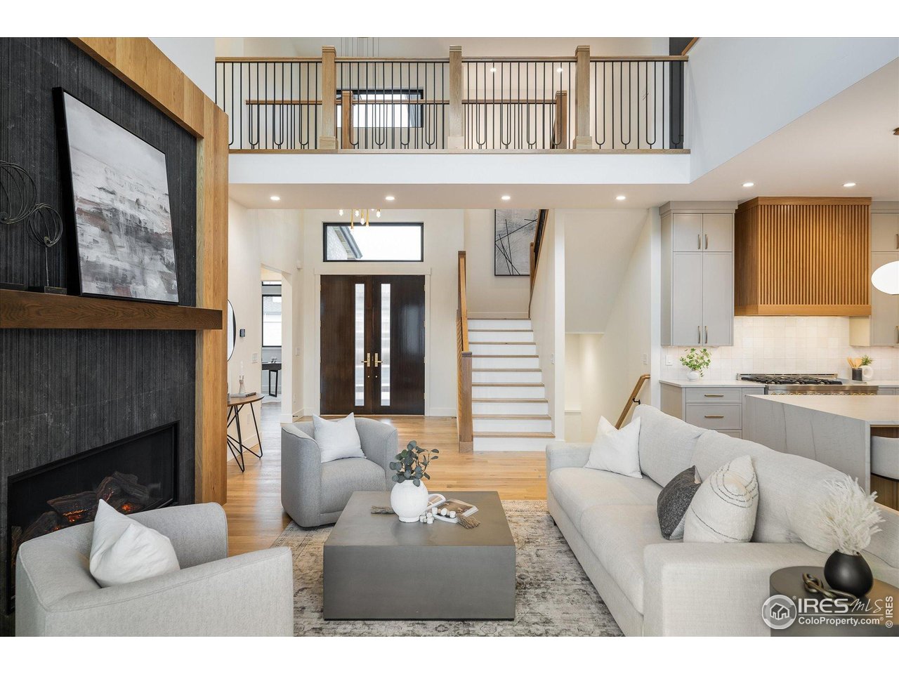 848 Trail Ridge Drive Louisville, CO 80027 - Photo 12 of 48 a living room with furniture a fireplace and a large window