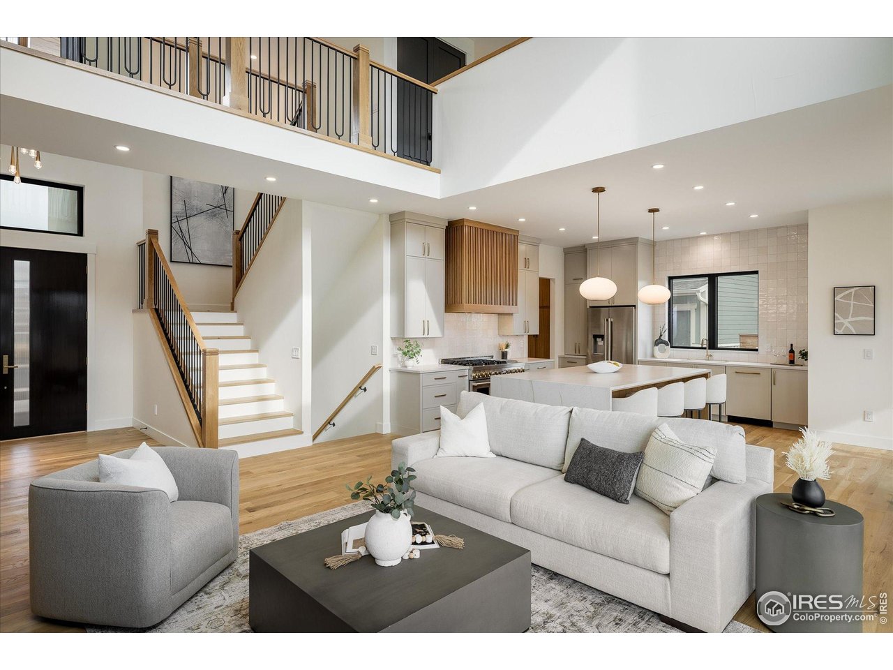 848 Trail Ridge Drive Louisville, CO 80027 - Photo 48 of 48 a living room with furniture and a wooden floor