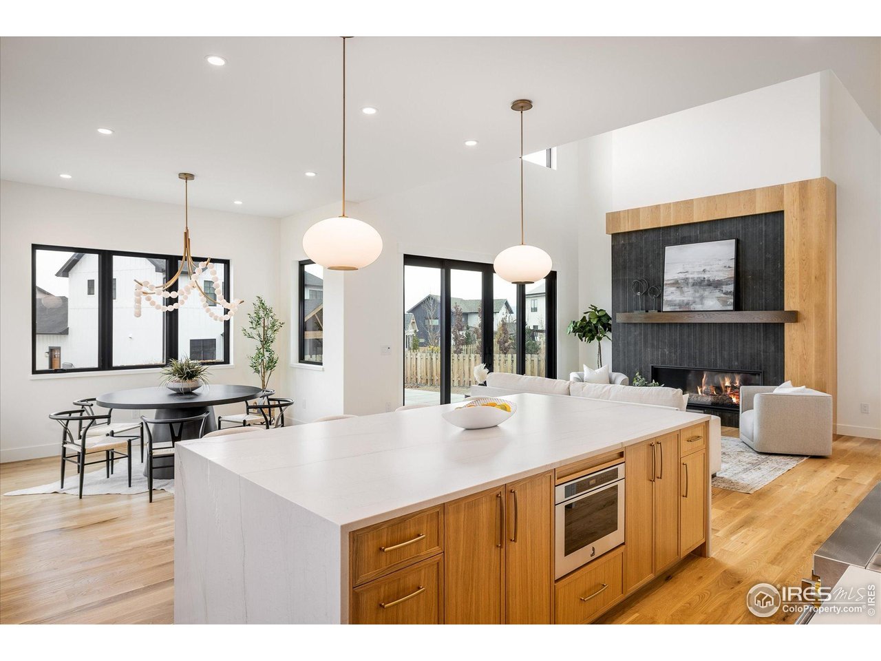 848 Trail Ridge Drive Louisville, CO 80027 - Photo 19 of 48 a kitchen with a stove a counter space a sink and living room view