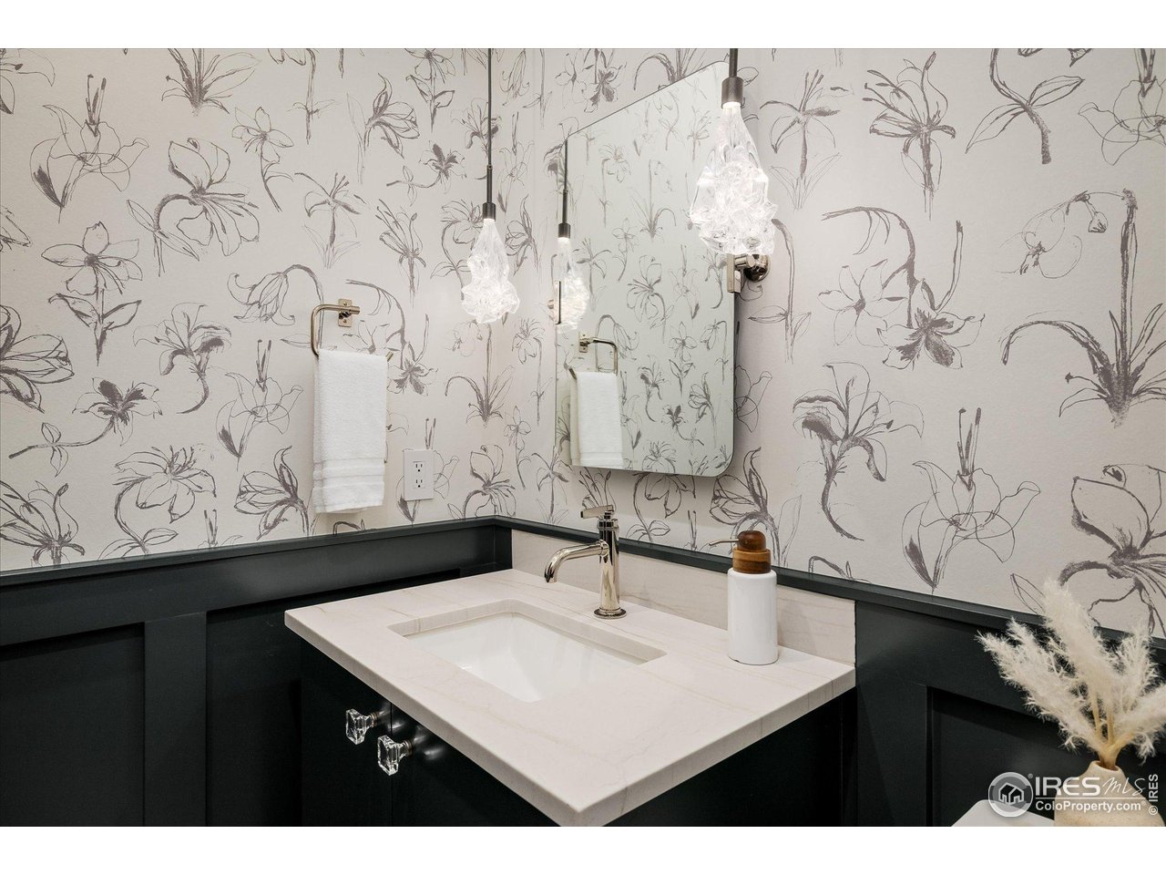 848 Trail Ridge Drive Louisville, CO 80027 - Photo 20 of 48 a bathroom with a sink and a mirror