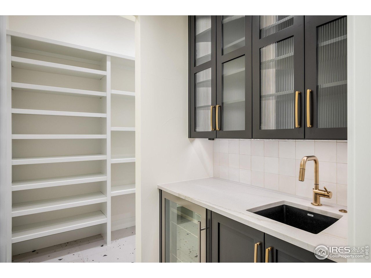 848 Trail Ridge Drive Louisville, CO 80027 - Photo 21 of 48 a kitchen with a sink and cabinets