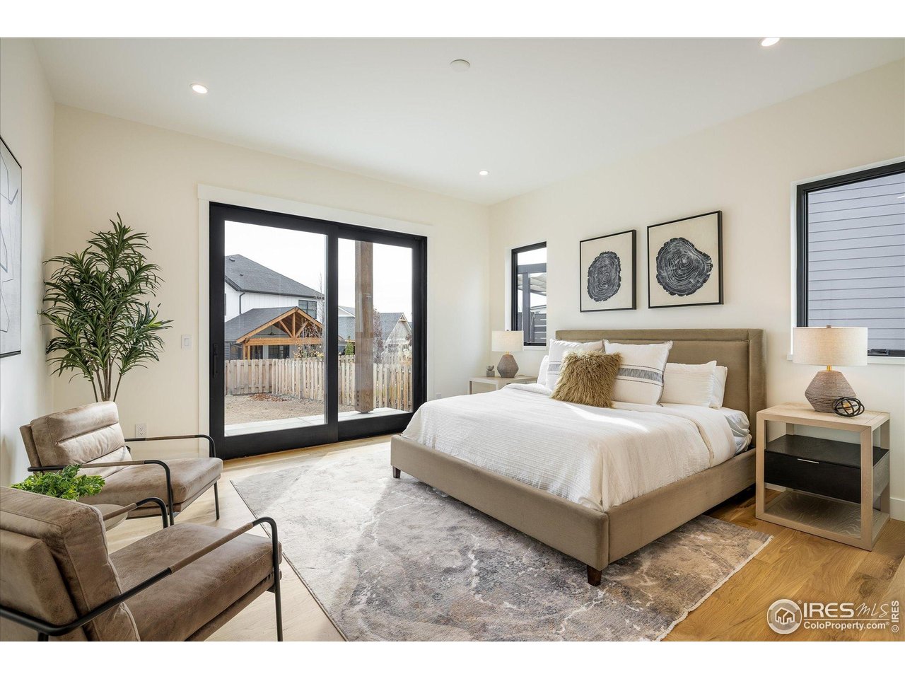 848 Trail Ridge Drive Louisville, CO 80027 - Photo 25 of 48 a spacious bedroom with a large bed and a couch