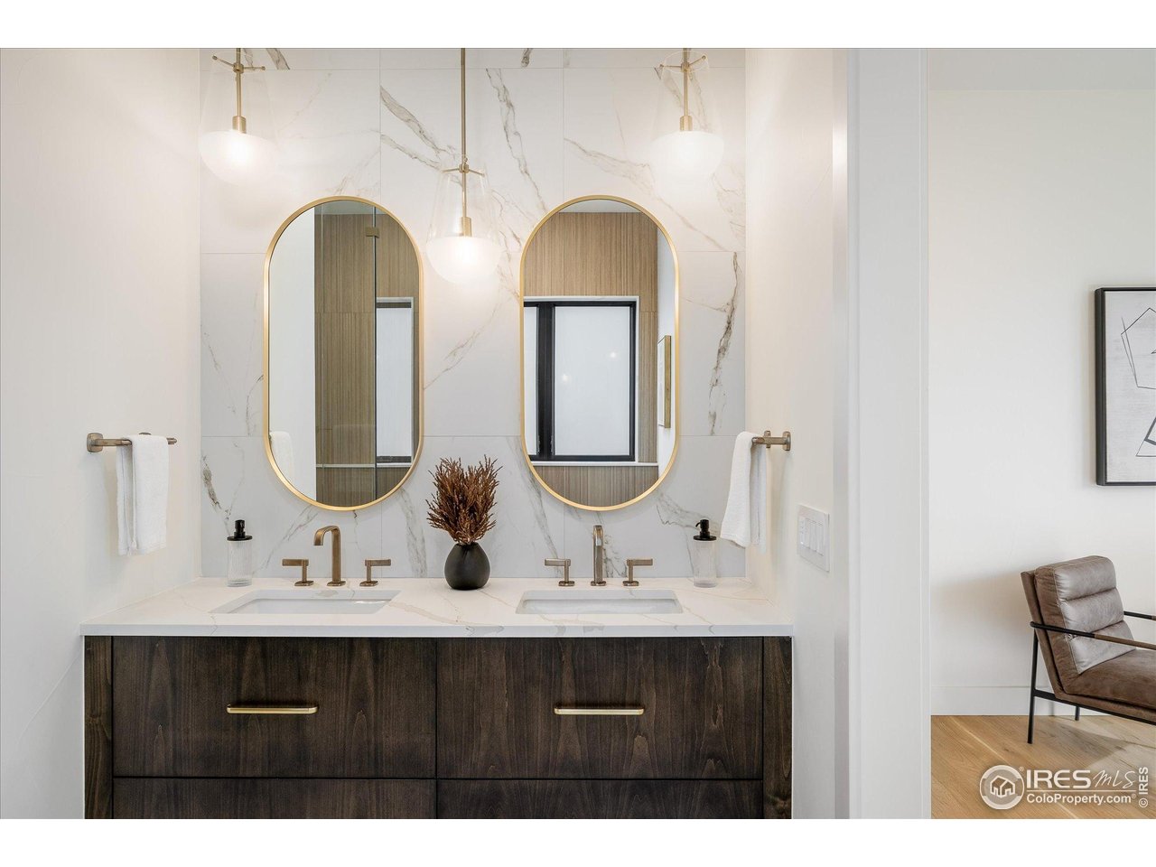 848 Trail Ridge Drive Louisville, CO 80027 - Photo 26 of 48 a bathroom with a double vanity sink and a mirror