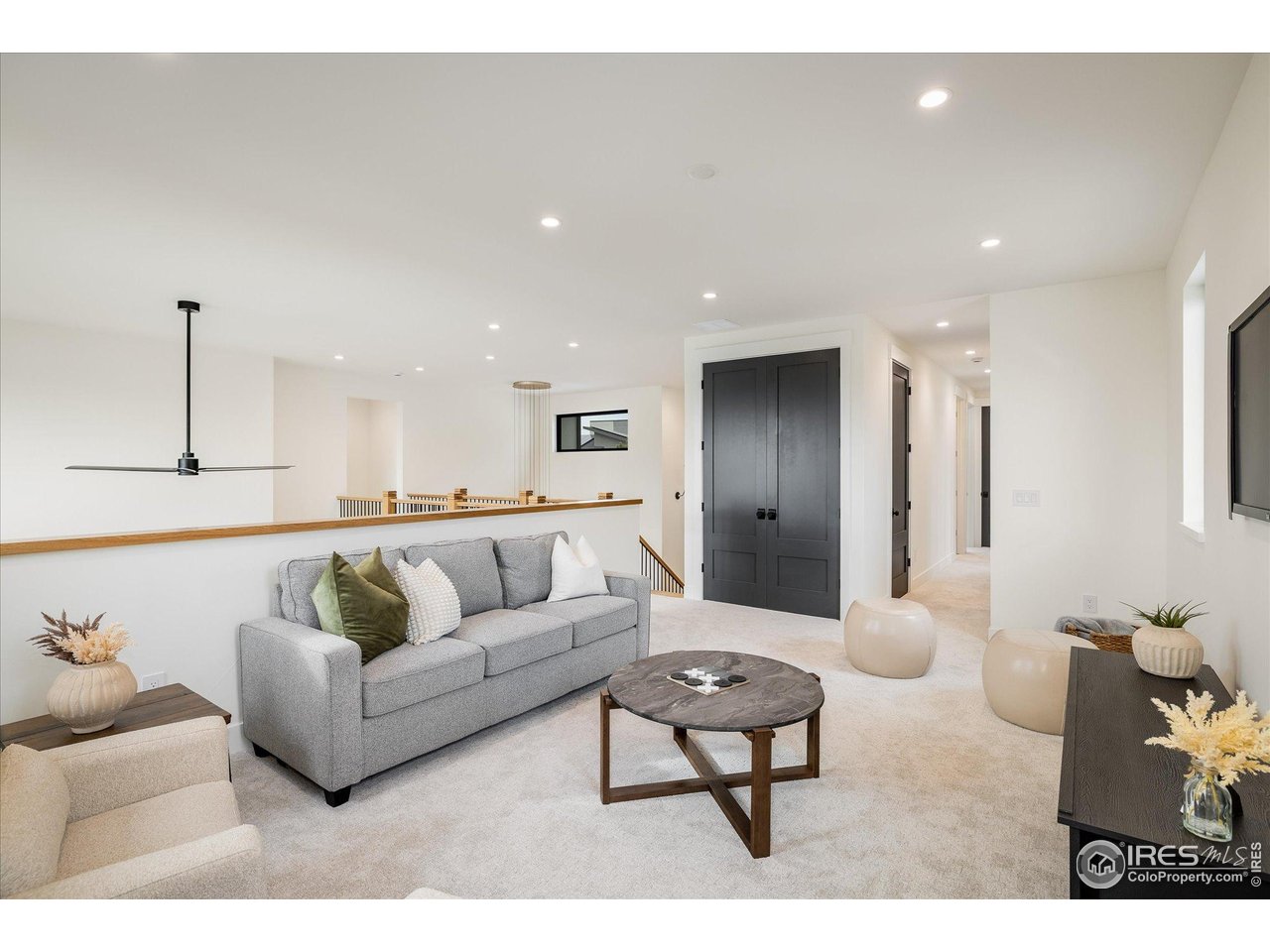 848 Trail Ridge Drive Louisville, CO 80027 - Photo 30 of 48 a living room with furniture and a couch