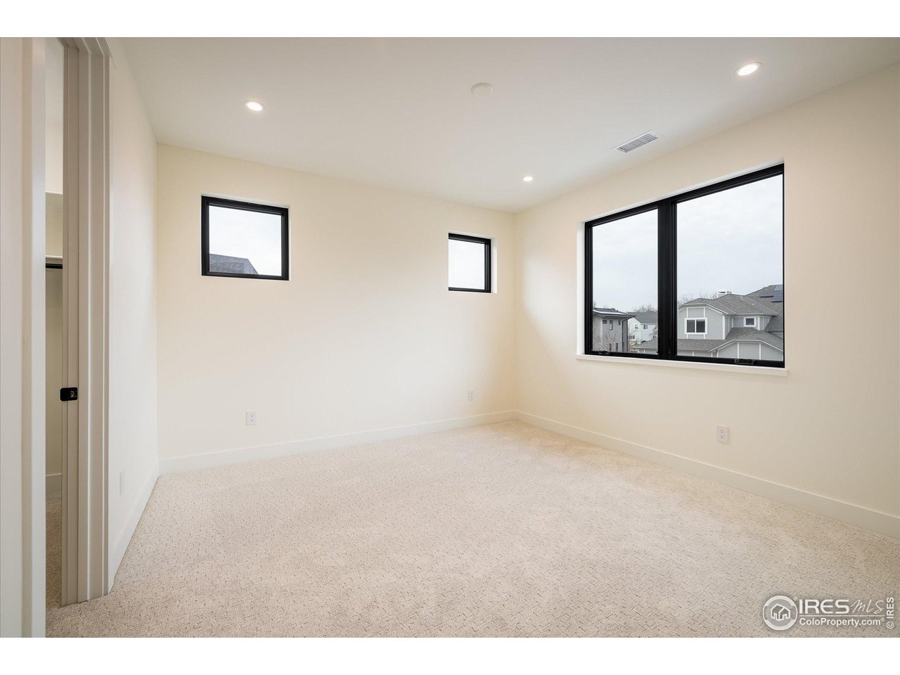 848 Trail Ridge Drive Louisville, CO 80027 - Photo 37 of 48 a view of an empty room with a window