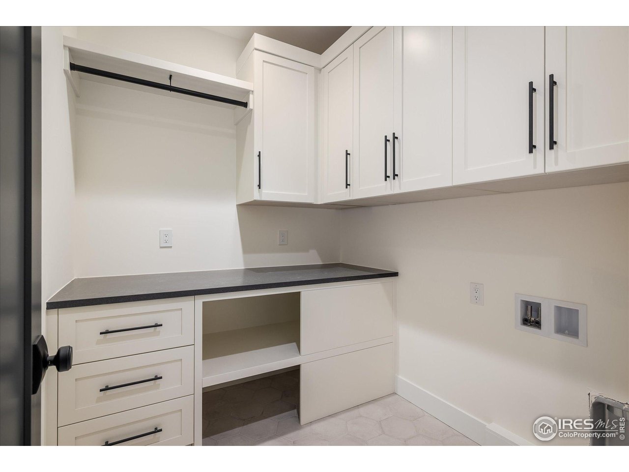 848 Trail Ridge Drive Louisville, CO 80027 - Photo 39 of 48 a kitchen with white cabinets and a sink