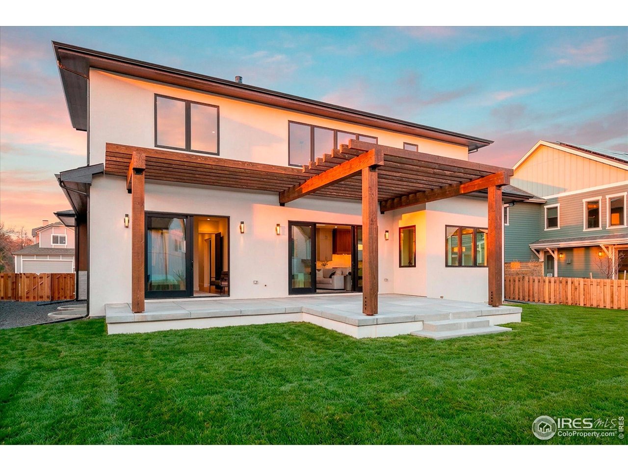 848 Trail Ridge Drive Louisville, CO 80027 - Photo 6 of 48 a front view of a house with a yard