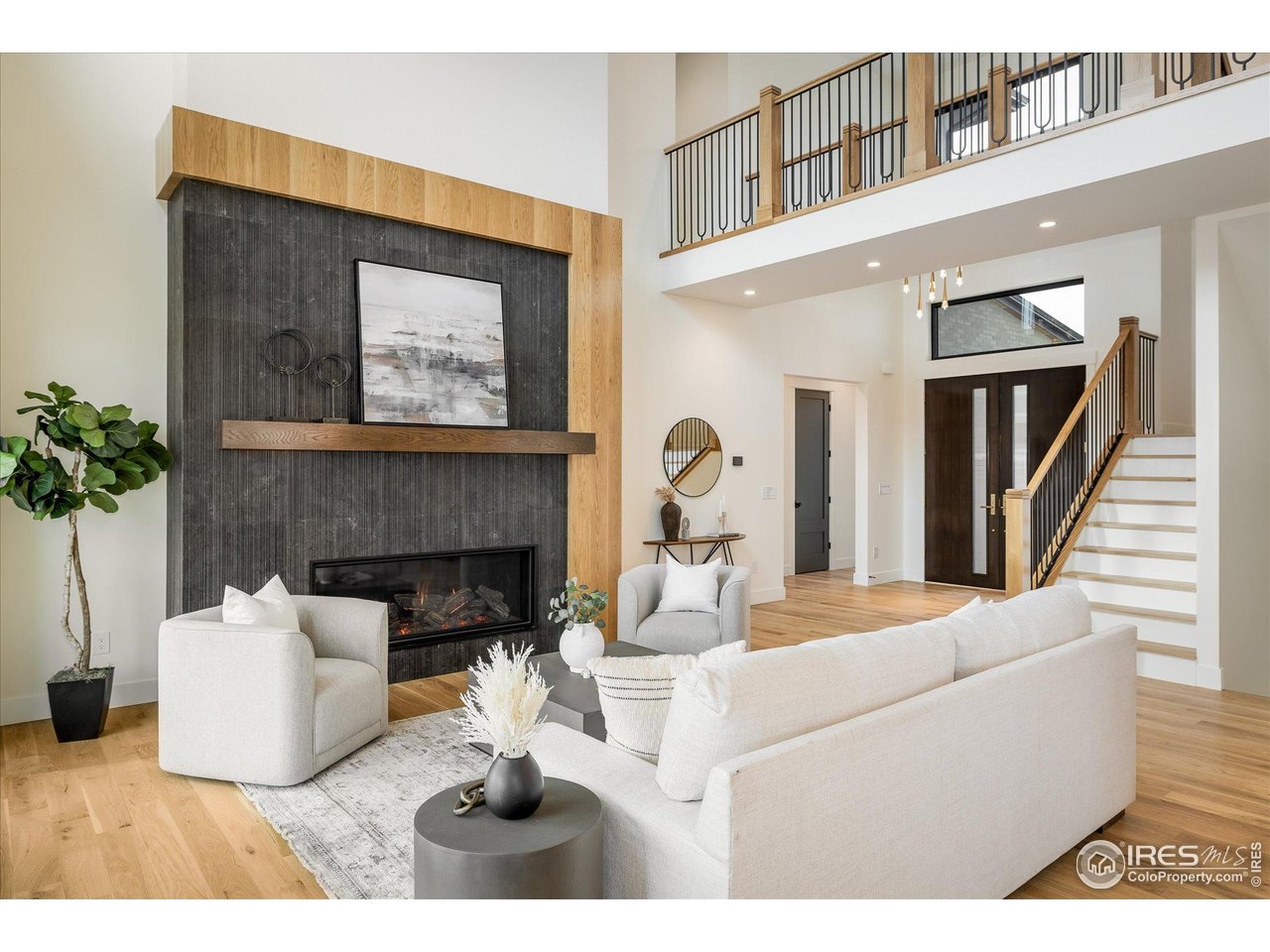 848 Trail Ridge Drive Louisville, CO 80027 - Photo 10 of 48 a living room with furniture a fireplace and a potted plant