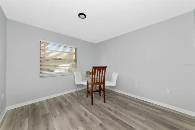 a view of a livingroom with furniture and wooden floor