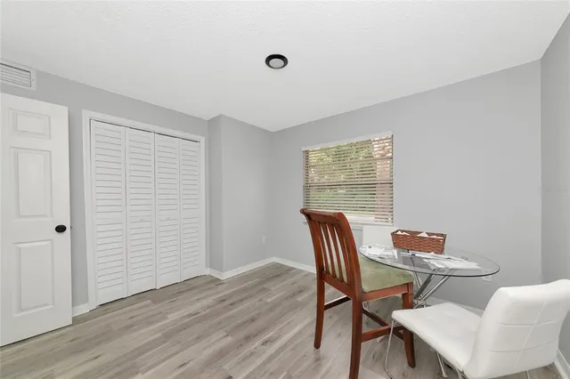 a dining room with furniture and window