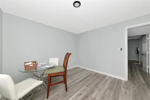a workspace room with furniture and wooden floor
