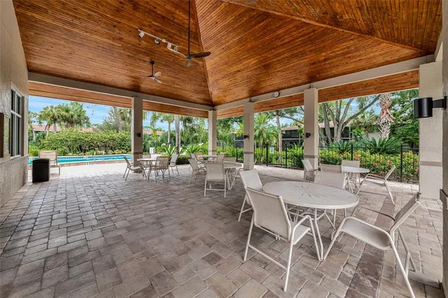 a view of a swimming pool with a yard