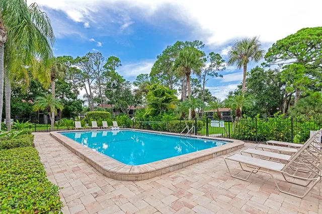 a view of a swimming pool with a patio