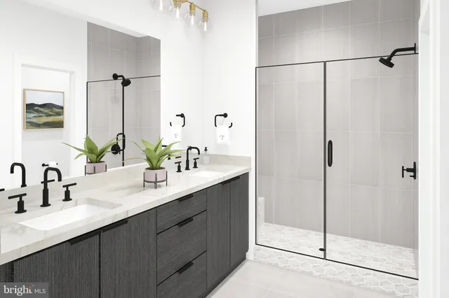 a bathroom with a double vanity sink mirror and shower