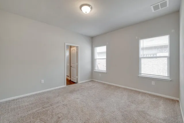 an empty room with windows