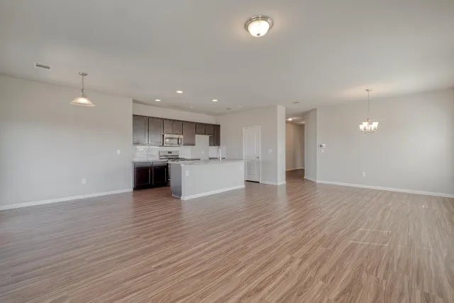 a view of kitchen with wooden floor