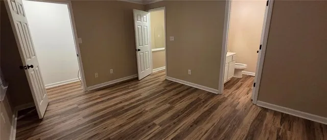 a view of a room with wooden floor and staircase