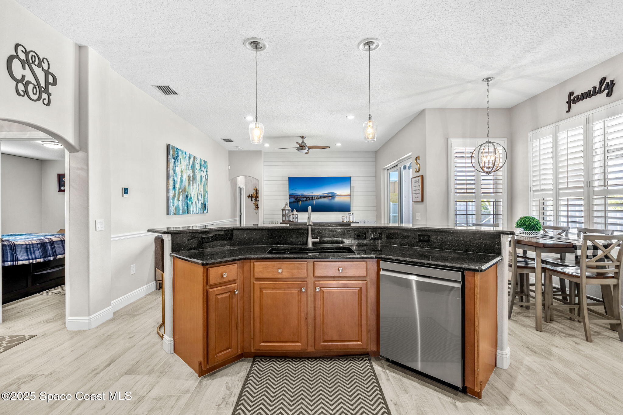 4440 Chardonnay Drive Rockledge, FL 32955 - Photo 11 of 41 a kitchen with granite countertop a sink and a stove